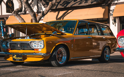 Shiny Yellow Station Wagon Parked Beside a Tree from Chrome web store to be run with OffiDocs Chromium online Shiny Yellow Station Wagon Parked Beside a Tree from Chrome web store to be run with OffiDocs Chromium online